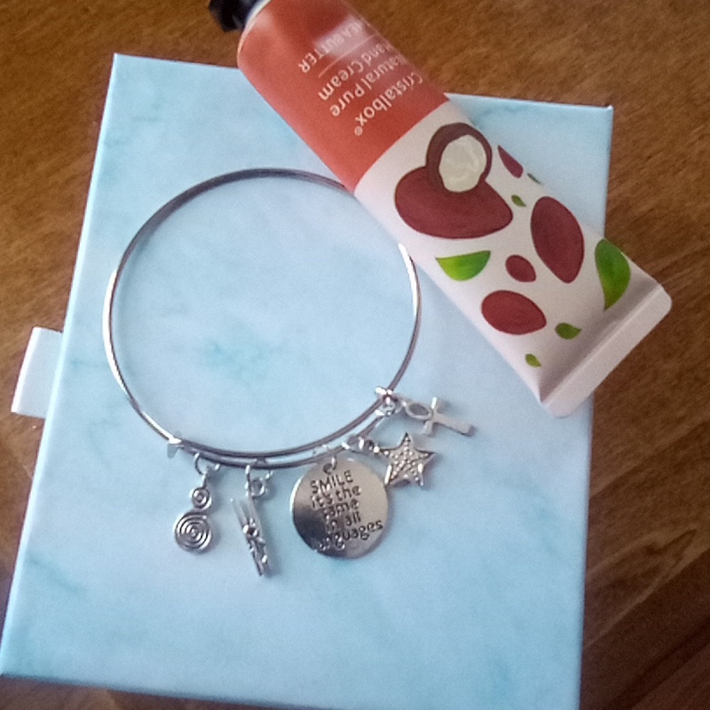 Smile it's the same in all languages braclet and lotion
